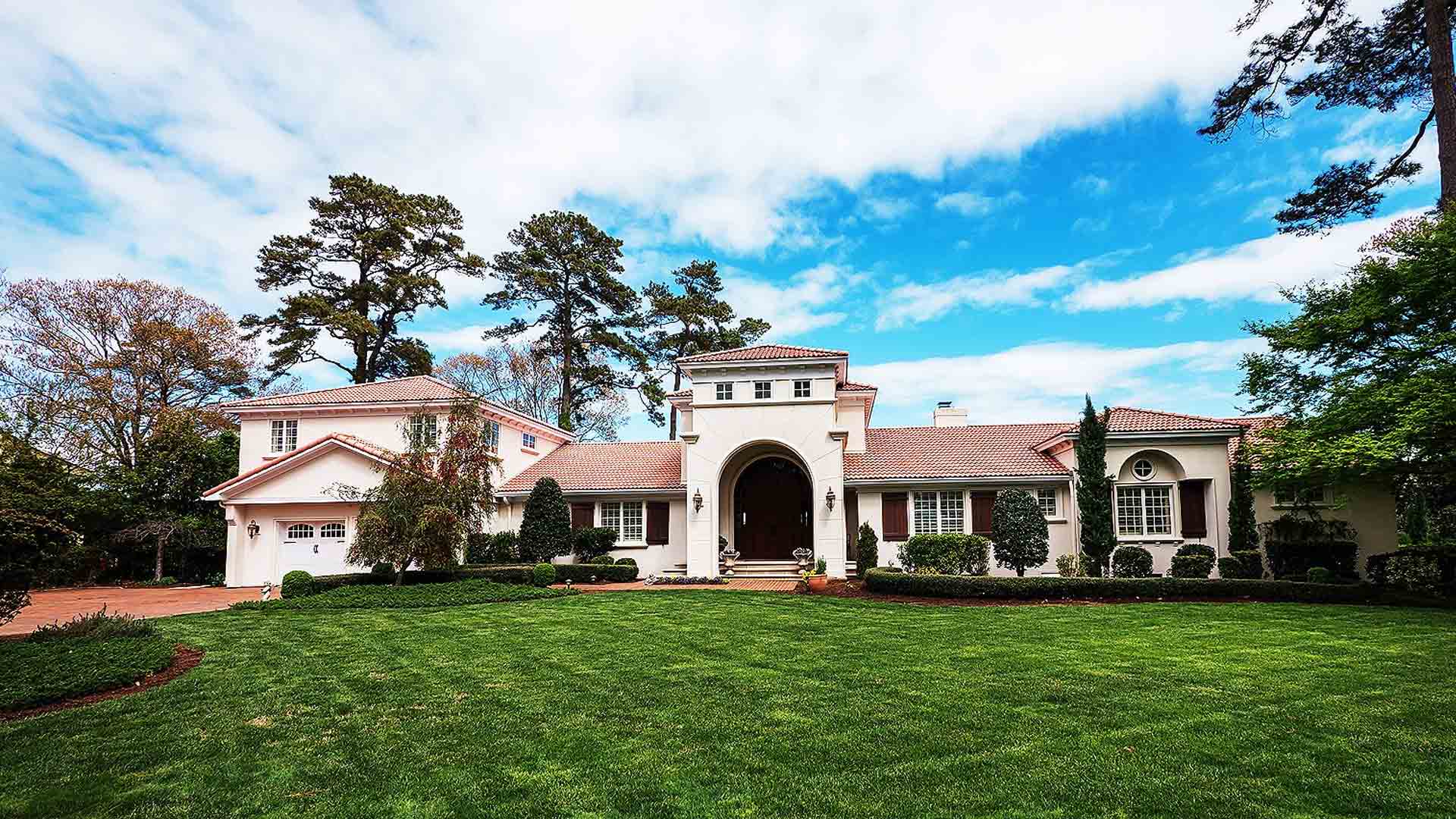 white mansion with red brick roofing