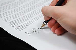 a homeowner signing a listing agreement
