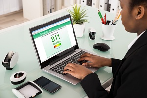 person checking credit score as one of the top 5 home buying tips