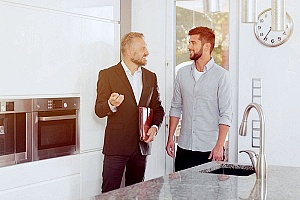a buyer speaking to his realtor about buying a home