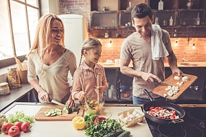 Family cooking together in kitchen