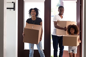 Happy family moving into home 