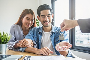 Landlord giving keys to renters 
