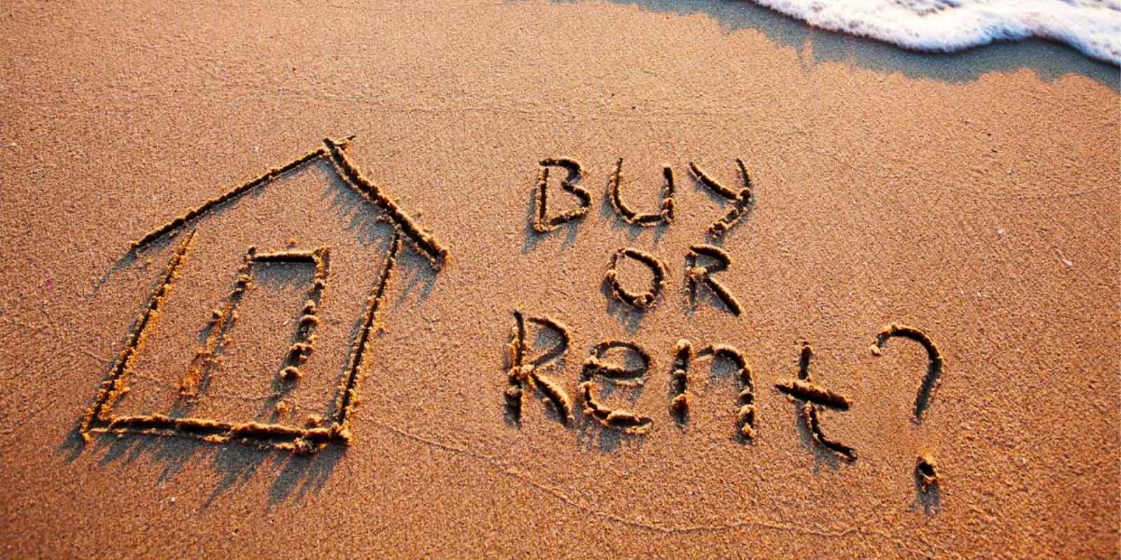 a-home-drawn-in-sand-with-the-words-buy-or-rent