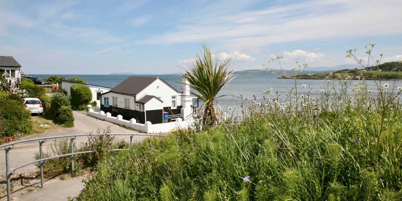 an oceanfront home that was acquired after a couple learned how to buy a beach house