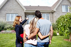 Real estate agent showing house to couple 