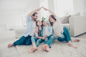 family sitting together in a new home