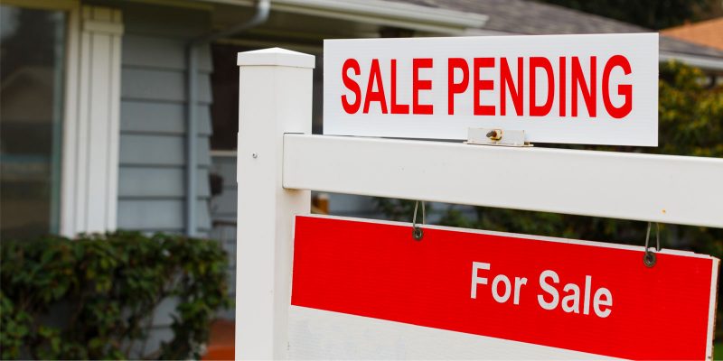 a sign of a home for sale that has a good walk score