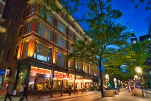 a street at night with a high walk score in real estate listings