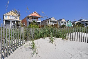 five colorful beach houses on the beach that can be good for investing opportunities