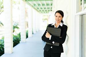 Woman listing agent standing outside 